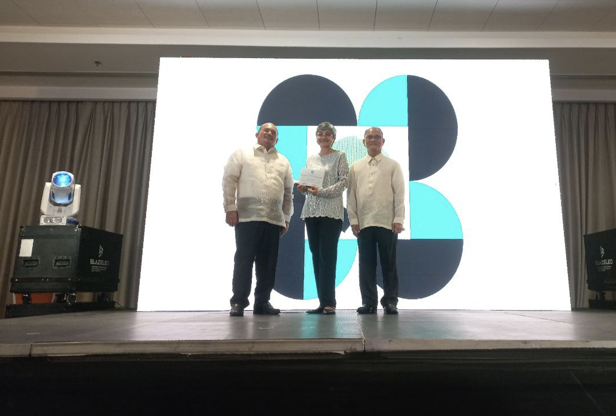 Dr. Pastor Jones T. Denusta, Dr. Mari-Ann M. Acedera, and Dr. Raul F. Muyong during the awarding of plaques to CMIs. Image Credit: MRRD-PCAARRD